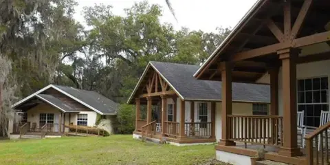 Exterior view of the wooden cottages and grounds at Chinsegut Hill Retreat and Conference Center.