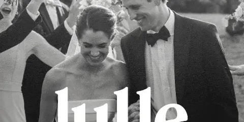 Black and white wedding photograph of a bride and groom smiling, with the Lulle Photo + Film logo overlaid.