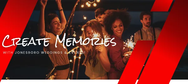A group of people dancing and holding sparklers at a night event.