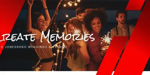 A group of people dancing and holding sparklers at a night event.