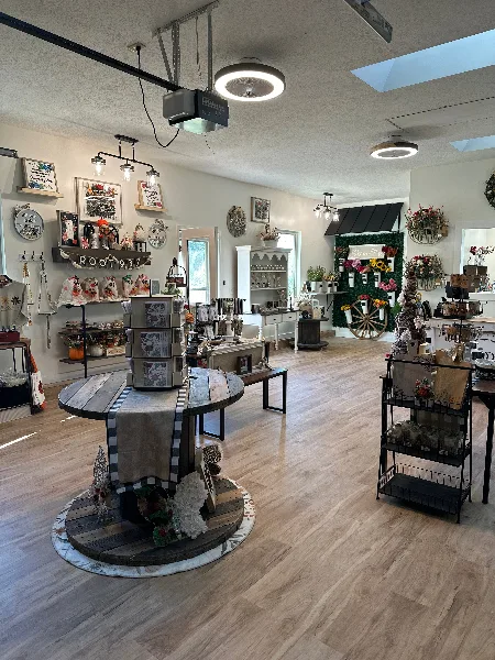 Interior view of the Root 937 store featuring rustic decor, wooden signs, and home goods on display.