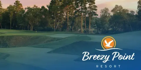 A view of the Breezy Point Resort golf course with a logo overlay.
