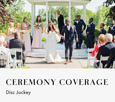 A wedding couple walking down the aisle during a ceremony at an outdoor gazebo venue.