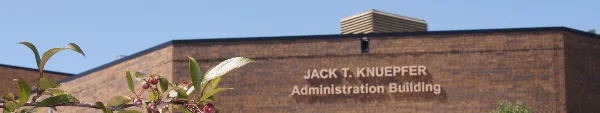 Exterior view of the Jack T. Kuepfer Administration Building, a brick courthouse structure.