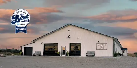 Exterior view of the Sunset Hill Event Center building at dusk