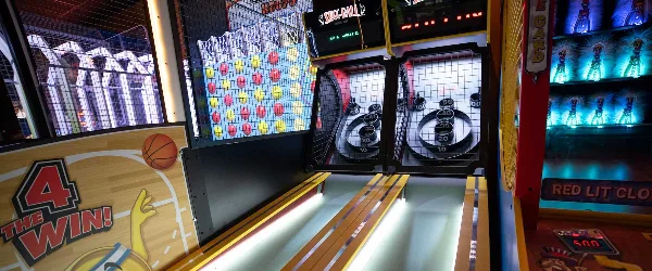 Interior view of The Dakota Center's FunZone arcade featuring Connect 4 Hoops and Skee-Ball games.
