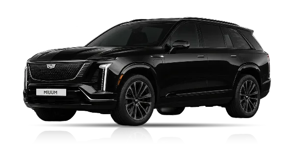 Black Cadillac Vistiq SUV with MIUUM license plate on a dark background