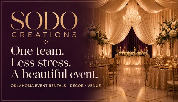 Decorated event venue with tables, chairs, floral arrangements, and draping, featuring SODO Creations branding.