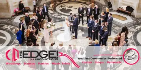 Overhead view of a wedding ceremony with a bride and groom exchanging vows in a large, ornate hall, with the EDGE! DJ Productions logo overlaid.