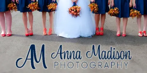Bride in a white gown and bridesmaids in blue dresses holding orange bouquets, with Anna Madison Photography logo overlaid.