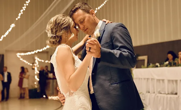 Bride and groom sharing their first dance at a wedding reception