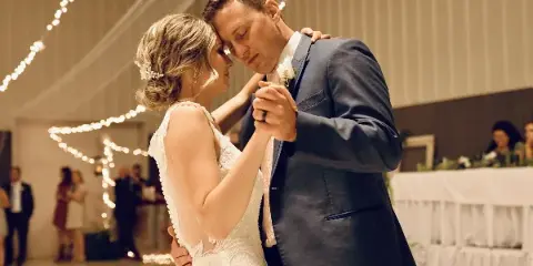 Bride and groom sharing their first dance at a wedding reception