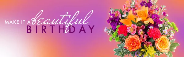 A colorful floral arrangement featuring orange roses, lilies, and purple flowers against a pink and orange gradient background.