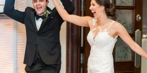 A bride and groom dancing at a wedding reception.