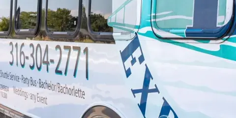 Side view of a white shuttle bus with 'Triple B's Express' branding and service details.