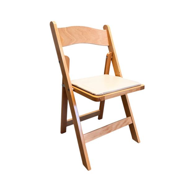 A natural wood folding chair with a light-colored cushion.
