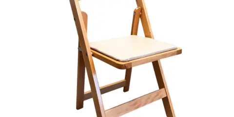 A natural wood folding chair with a light-colored cushion.