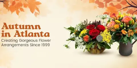 Two floral arrangements featuring red roses, yellow flowers, and greenery in decorative vases against a background of autumn leaves.